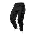 Pantalones cargo holgados de hombre en color liso con múltiples bolsillos y puños con cordón, marca AriasCreative.